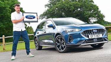 Ford Focus estate long term-test - Steve Walker holding screen